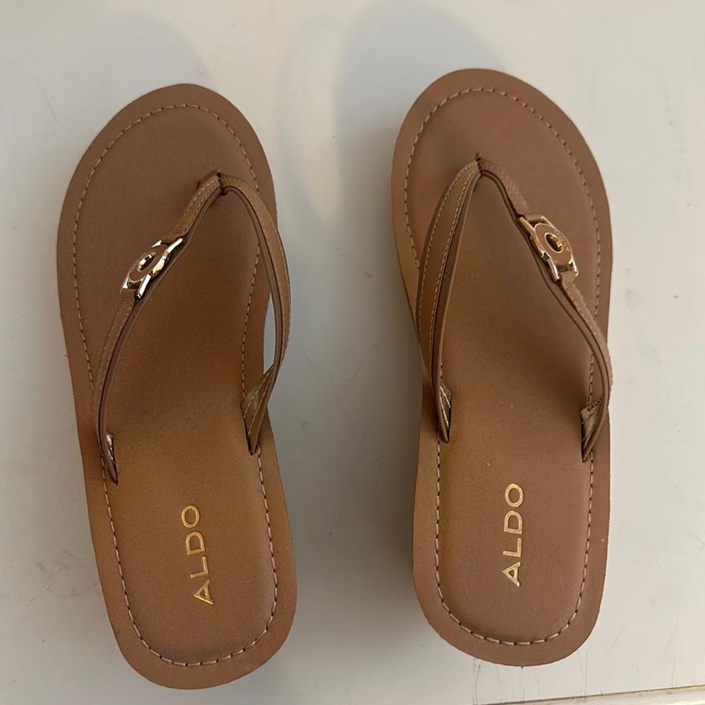Also women’s sandals with wedge.  Size 8.5 in camel color